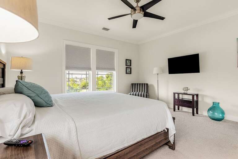 Escape to luxury in our 3rd level master suite, where a king-size bed beckons for a restful night`s sleep.